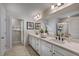 Double vanity bathroom with a large mirror and a walk-in shower at 166 Blue Butterfly Dr, Angier, NC 27501