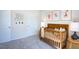 Bedroom featuring crib, charming wall art, and ample closet space at 166 Blue Butterfly Dr, Angier, NC 27501