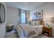 Bedroom with a bed, nightstands, and window coverings at 166 Blue Butterfly Dr, Angier, NC 27501