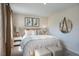 Serene bedroom with king-size bed and stylish decor at 166 Blue Butterfly Dr, Angier, NC 27501