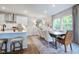 Dining area with wood table and neutral colored chairs at 166 Blue Butterfly Dr, Angier, NC 27501