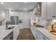 Open concept kitchen with island and stainless steel appliances at 166 Blue Butterfly Dr, Angier, NC 27501