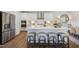 Modern kitchen with stainless steel appliances and white cabinetry at 166 Blue Butterfly Dr, Angier, NC 27501