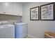 Convenient laundry room with washer, dryer, and cabinets at 166 Blue Butterfly Dr, Angier, NC 27501