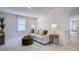 Cozy sitting area with comfortable couch and ottoman, perfect for relaxing at 166 Blue Butterfly Dr, Angier, NC 27501