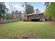 Large backyard with a home and wooden privacy fence at 2946 Glenridge Dr, Raleigh, NC 27604