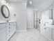 Elegant bathroom with double vanity, soaking tub, and a large shower at 4700 Linaria Ln, Fuquay Varina, NC 27526