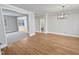 Bright dining room with hardwood floors and access to the kitchen and living room at 4700 Linaria Ln, Fuquay Varina, NC 27526