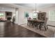 Bright dining room with hardwood floors and a chandelier at 8833 Tartan Clan Dr, Angier, NC 27592