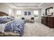 Main bedroom with king-size bed and two armchairs at 8833 Tartan Clan Dr, Angier, NC 27592