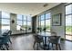Bright common area with tables and chairs, offering ample natural light at 120 Mosaic Blvd # 307, Pittsboro, NC 27312