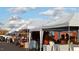 Outdoor market with various vendors under tents at 120 Mosaic Blvd # 307, Pittsboro, NC 27312