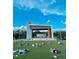 Community park with an outdoor stage and people doing yoga at 120 Mosaic Blvd # 307, Pittsboro, NC 27312