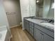 Double vanity bathroom with granite countertops at 172 Tulipfield Way, Benson, NC 27504