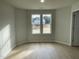Bright bedroom with large windows and hardwood floors at 172 Tulipfield Way, Benson, NC 27504