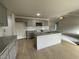 Open concept kitchen with gray cabinets and granite countertops at 172 Tulipfield Way, Benson, NC 27504