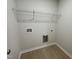 Laundry room with wire shelving and space for washer/dryer at 172 Tulipfield Way, Benson, NC 27504