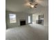 Open living room with fireplace and view into kitchen at 172 Tulipfield Way, Benson, NC 27504