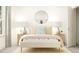 Bright bedroom with a double bed, nightstands, and ample natural light at 2212 Birdhouse Ln, Wake Forest, NC 27587