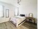 Bright bedroom with a queen-size bed and a vanity at 242 Liam St, Clayton, NC 27520