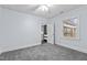 Bright bedroom with ceiling fan and grey carpet at 302 12Th St, Butner, NC 27509