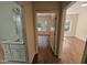 Well-lit hallway with wood flooring and access to bedrooms and bathroom at 3544 Bryn Mawr Ct, Raleigh, NC 27606