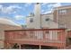 Townhouse backyard with deck and partial view of trees at 6525 New Market Way, Raleigh, NC 27615