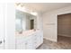 Double vanity bathroom with marble countertop and walk-in closet at 68 Northwood Dr, Fuquay Varina, NC 27526