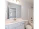 Clean bathroom with white vanity, toilet and bathtub at 68 Northwood Dr, Fuquay Varina, NC 27526