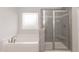 Bathroom with soaking tub and walk-in shower at 68 Northwood Dr, Fuquay Varina, NC 27526