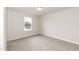 Simple bedroom with grey carpet and a window at 68 Northwood Dr, Fuquay Varina, NC 27526