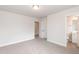 Spacious bedroom with grey carpet and an ensuite bathroom at 68 Northwood Dr, Fuquay Varina, NC 27526