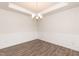 Formal dining room with hardwood floors, chandelier, and wainscoting at 68 Northwood Dr, Fuquay Varina, NC 27526