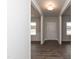 Bright entryway with dark hardwood floors, leading to the living room at 68 Northwood Dr, Fuquay Varina, NC 27526