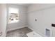 Laundry room with built-in shelving at 68 Northwood Dr, Fuquay Varina, NC 27526