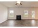 Bright living room featuring hardwood floors and fireplace at 68 Northwood Dr, Fuquay Varina, NC 27526