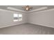 Large main bedroom with ceiling fan and carpeting at 68 Northwood Dr, Fuquay Varina, NC 27526