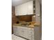 White cabinets, double sink, and dishwasher in this galley kitchen at 807 W Trinity Ave # 209, Durham, NC 27701