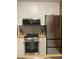 Modern kitchen with stainless steel appliances and white cabinets at 807 W Trinity Ave # 209, Durham, NC 27701