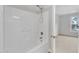 Bathroom with shower/tub combo and view of bedroom at 9009 Grassington Way, Raleigh, NC 27615