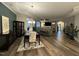 Open concept dining area with hardwood floors and a chandelier at 1007 Gramercy Ct, Mebane, NC 27302