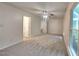 Spacious bedroom with carpet, ceiling fan, and access to bathroom at 111 Whithorne Dr, Garner, NC 27529
