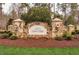 Elegant entrance to the Estates at Laurel Ridge community, featuring stone pillars and landscaping at 175 Clear Springs Ct, Pittsboro, NC 27312
