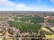 Aerial view of a expansive property with forest and open areas at 2001 Wheelers Church Rd Rd, Hurdle Mills, NC 27541