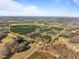 Aerial view of a large land with lush forest and open fields at 2001 Wheelers Church Rd Rd, Hurdle Mills, NC 27541