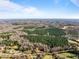 Aerial view of a large property with forest and open areas at 2001 Wheelers Church Rd Rd, Hurdle Mills, NC 27541