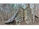 Image shows dilapidated cabin with stone chimney at 2001 Wheelers Church Rd Rd, Hurdle Mills, NC 27541