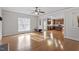 Bright and airy living room with hardwood floors and kitchen view at 4324 Brighton Ridge Dr, Apex, NC 27539