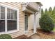 Townhome's front entrance with a gray door and sidelight at 4948 Lady Of The Lake Dr, Raleigh, NC 27612