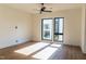 Spacious bedroom with hardwood floors and large windows at 512 Gordon Street # 605, Durham, NC 27701